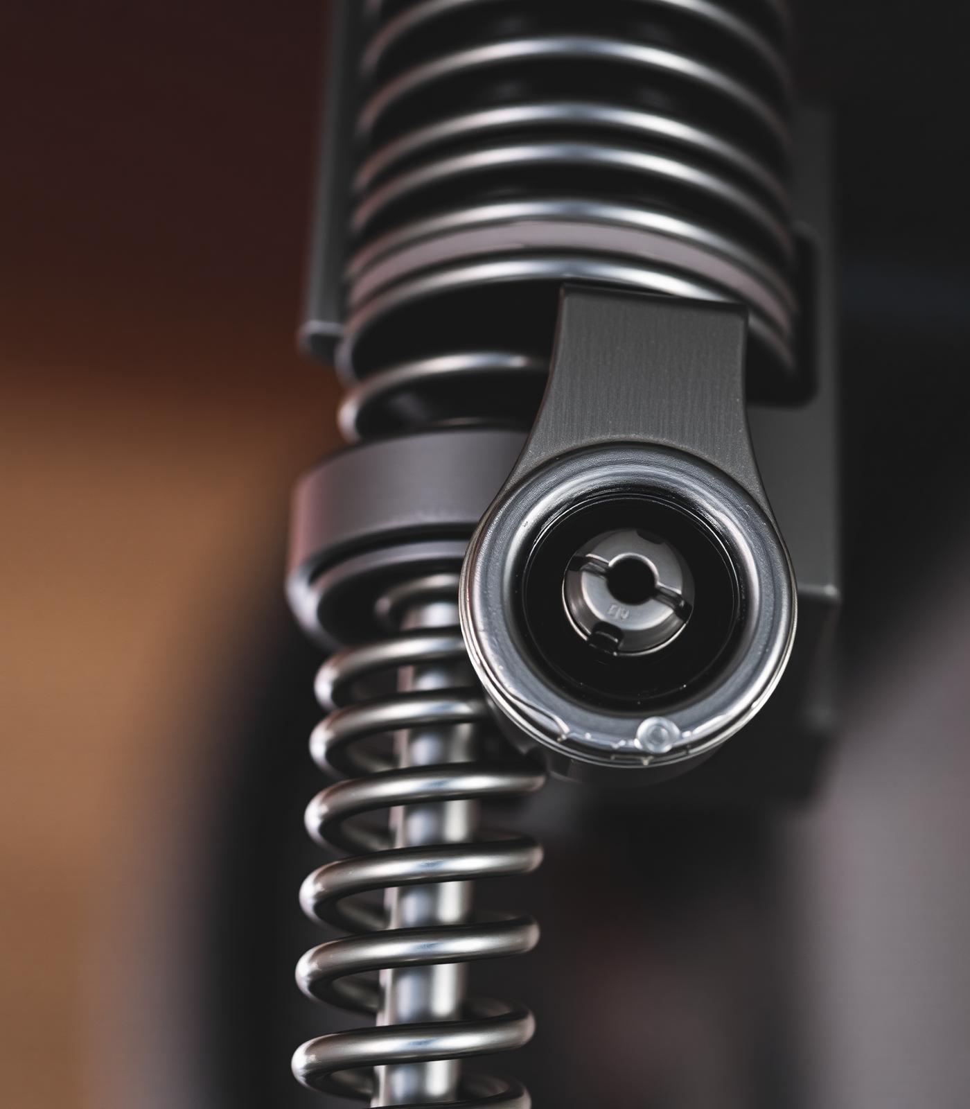 Macro close-up of a chromed torsion spring assembly